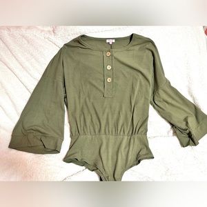 Olive green bodysuit with batwing sleeves.